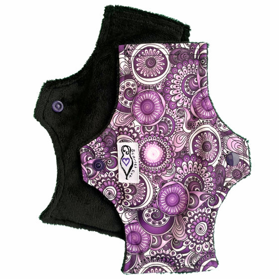 Scarlet Eve Purple Floral New Woman Pad. Top: Plush Black Minky. Bottom: Purple, Black and White Floral PUL. 3 layer flip-out bamboo fleece booster. New Woman Pads are designed with the young teen in mind.