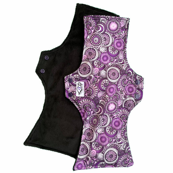 Scarlet Eve Purple Floral Uber Long Pad. Top: Plush Black Minky. Bottom: Purple, Black and White floral PUL. 4-layer flip out bamboo fleece booster. For our greatest absorbency and length.