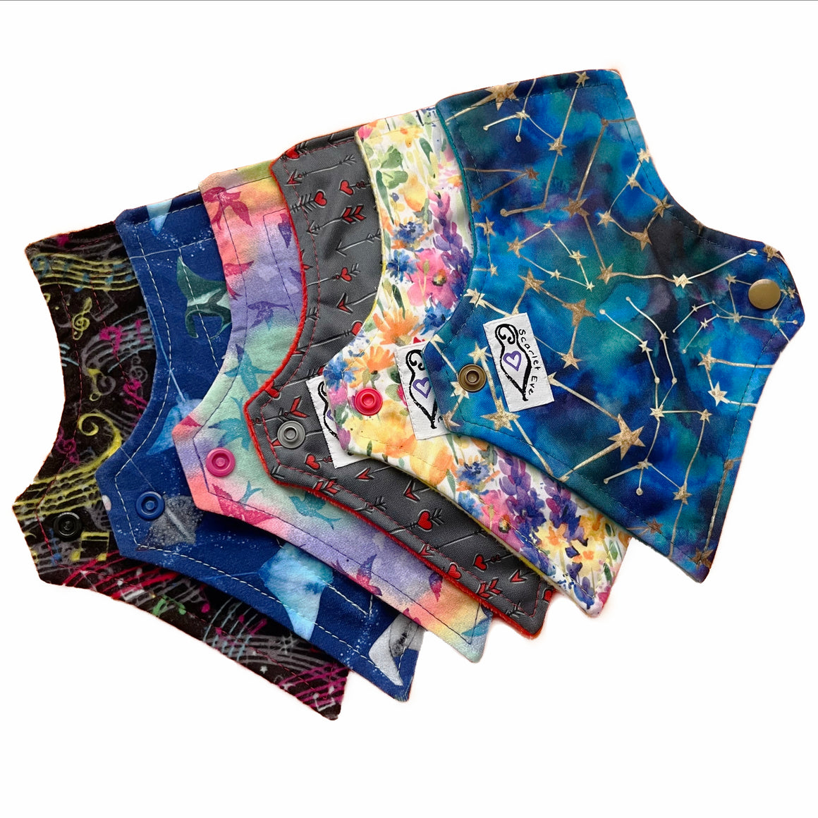 A set of six assorted tapered mini pads with various colorful patterns, against a white background. The Pads are squared at the top and tapered at the bottom.