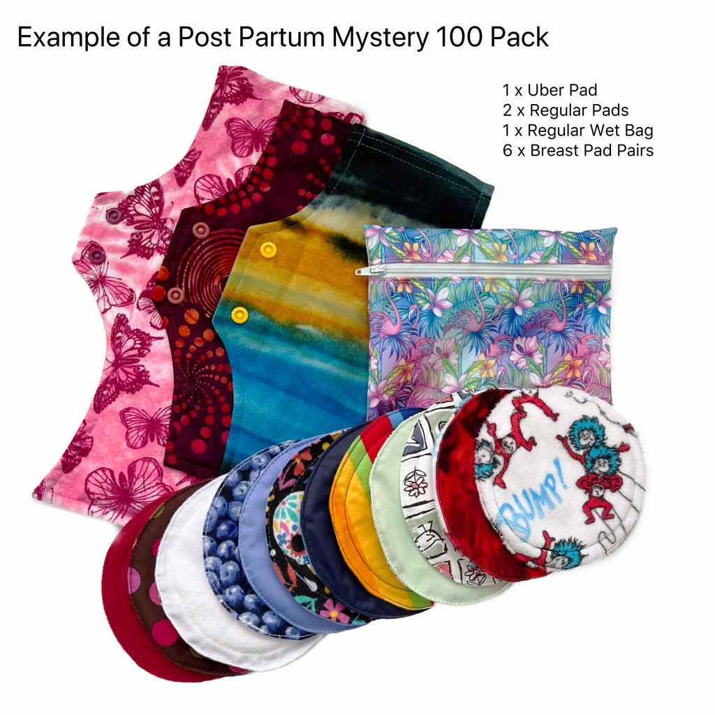 A variety of reusable menstrual pads and reusable breast pads in different shapes sizes and fabrics, and a Wet Bag made from Flamingo print fabric, against a white background. Text reads "Example of a Post Partum Mystery 100 Pack. 1 x Uber Pad, 2 x Regular Pads, 1 x Regular Wet Bag, 6 x Breast Pad Pairs"