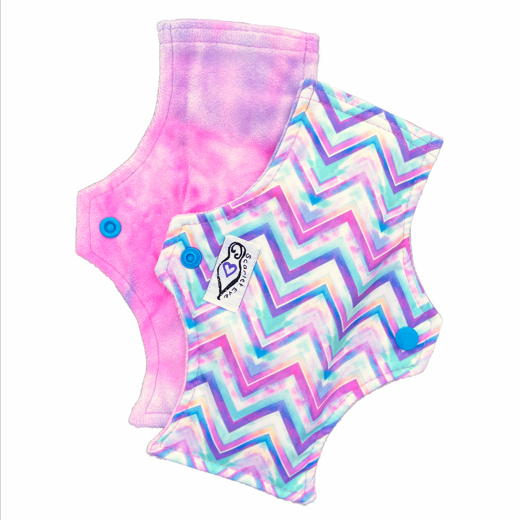 Scarlet Eve Pastel Chevron New Woman Pad. Top: Plush Pink and Blue Minky. Back: Pastel Chevron PUL. 3-layer flip out bamboo fleece booster. New Woman Pads have been designed with the young teen in mind.