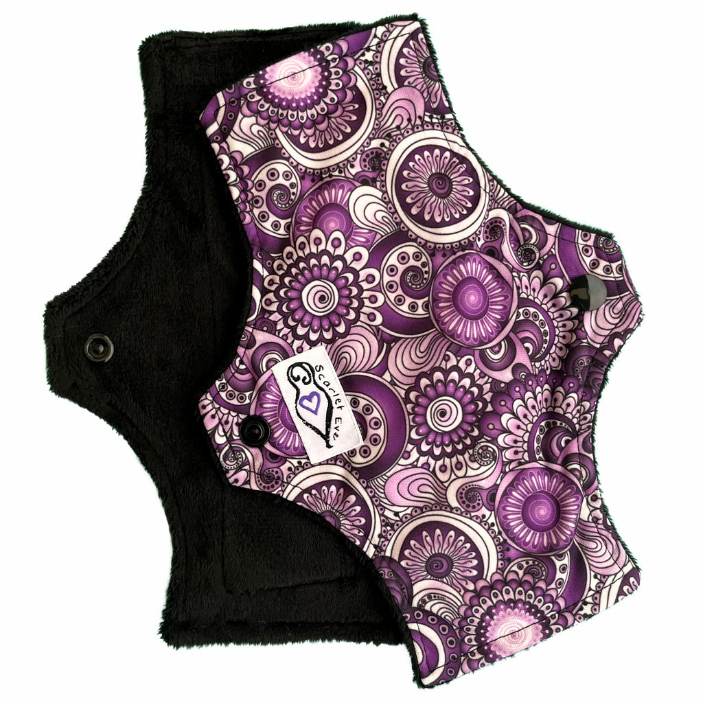 Scarlet Eve Purple Floral Mini Pad. Top: Plush Black Minky. Purple, Black and White Floral PUL. 2 layer bamboo fleece booster sewn in. The original lightweight pad from Scarlet Eve.