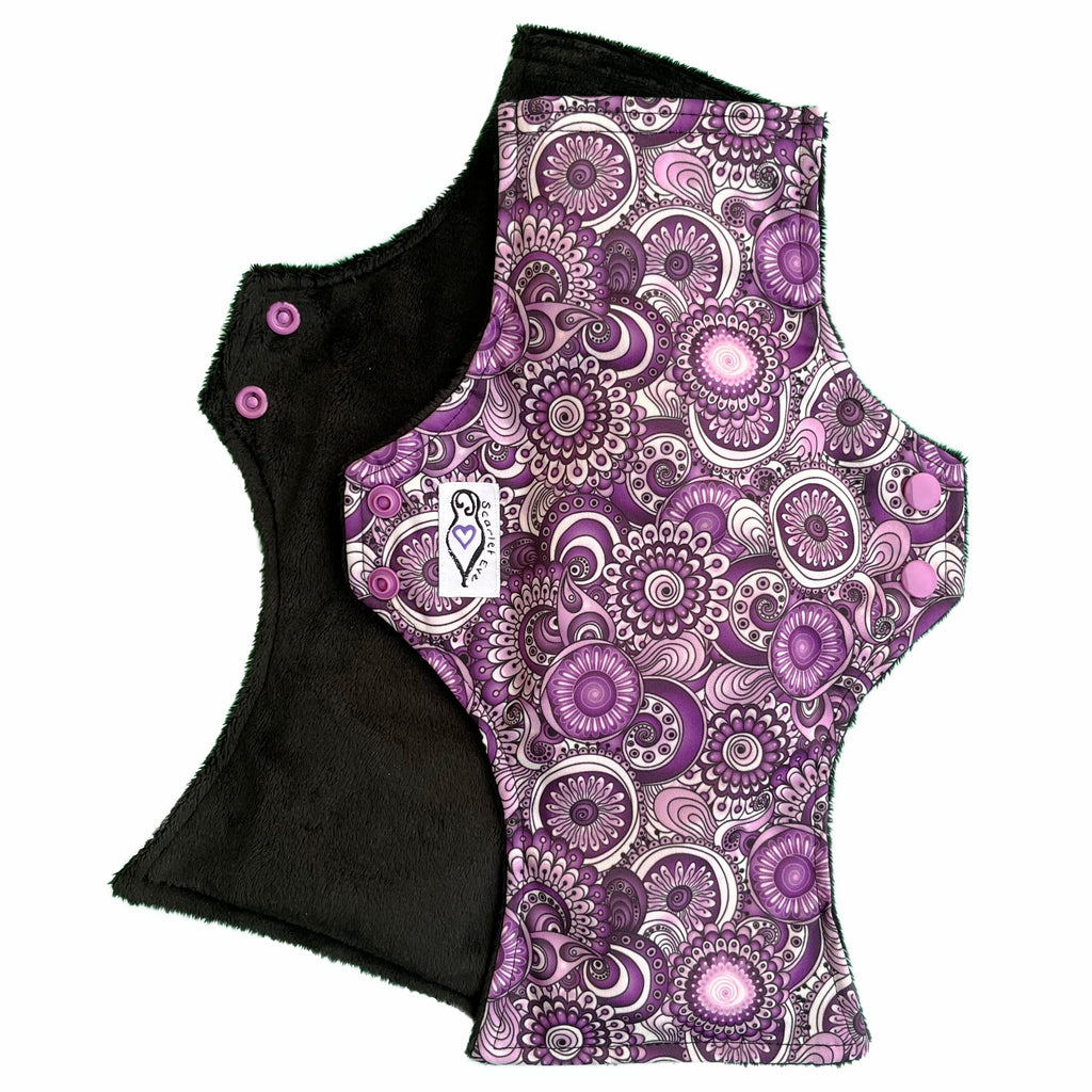 Scarlet Eve Purple Floral Uber Pad. Top: Plush Black Minky. Bottom: Purple, Black and White Floral PUL. 4 layer flip-out bamboo booster. For extra absorbency and length.