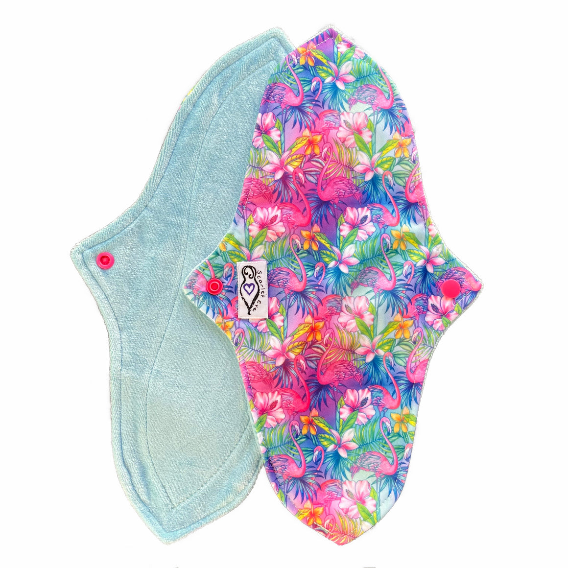 Two reusable menstrual pads with a contoured shape against a white background. The pad on top is made from  light blue fabric with a bright, tropical flamingos print and has a white "Scarlet Eve" label. The pad on the bottom is made from light blue bamboo velour fabric.