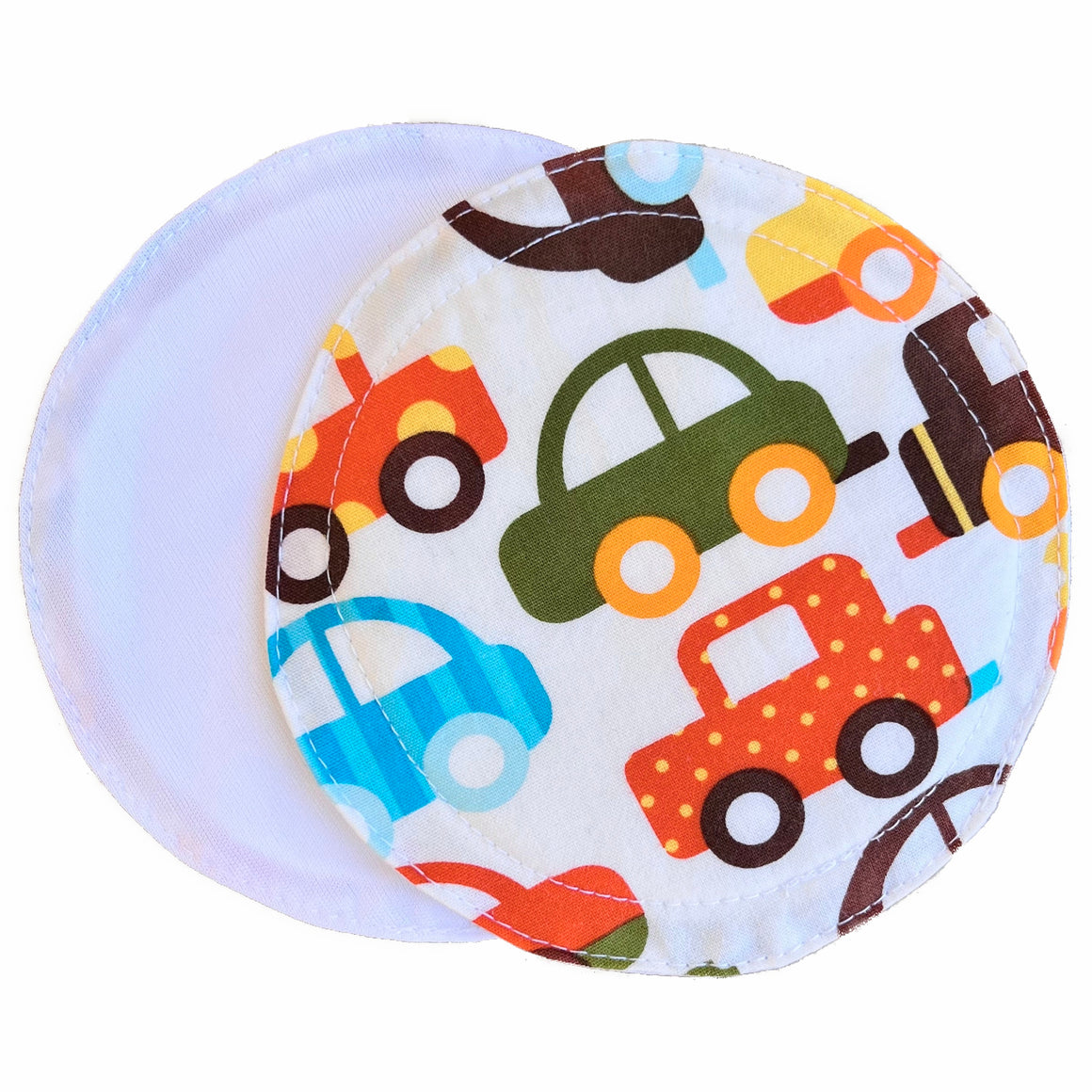 Scarlet Eve Organic Cars Breast Pads. Top: organic woven cotton with cute orange, aqua blue, olive green, golden yellow and chocolate brown cartoon cars on a white background. Back: Solid white PUL. 2 layers bamboo fleece sewn in. Scarlet Eve breast pads have generous coverage and superior absorbency.