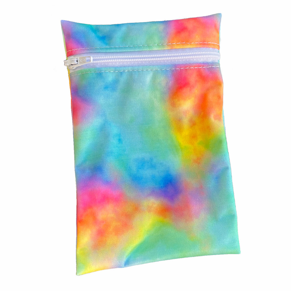 A rectangular zippered pouch against a white background. The wet bag is made from PUL fabric with a bright, multicoloured print. A white coloured zip runs along the pouch towards the top.